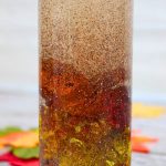 glitter swirling in a fall sensory bottle